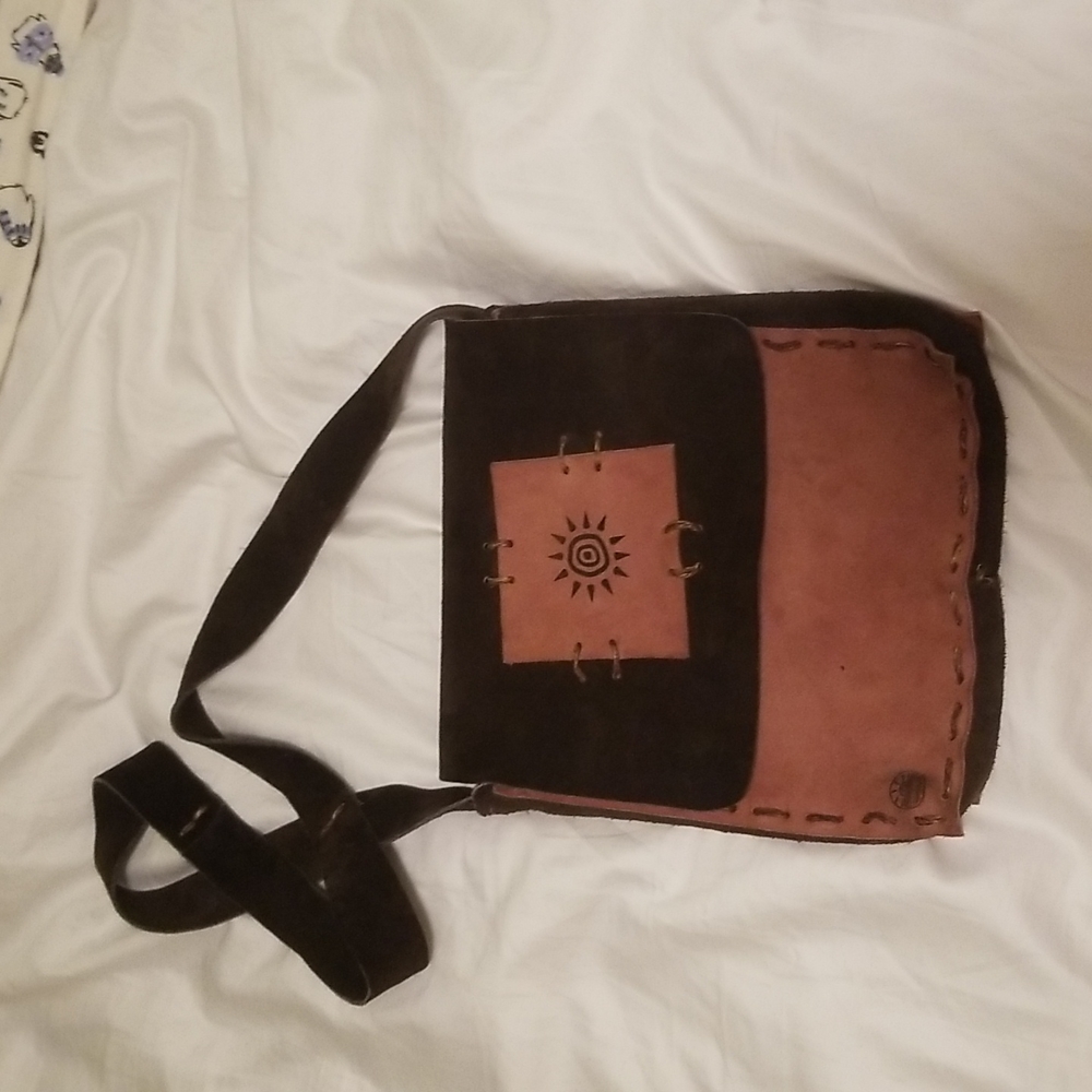 Leather hand made cross body bag.